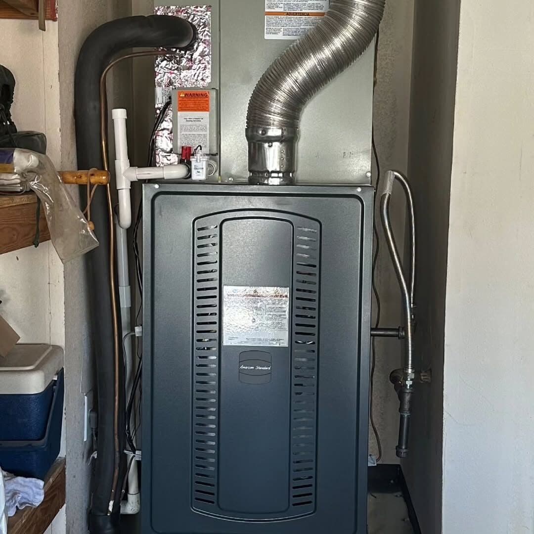 The new American Standard furnace in the same closet with new flue and line work