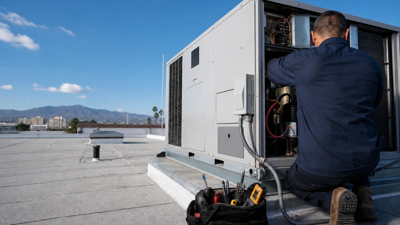 Rooftop packaged HVAC unit being serviced before business hours